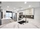 Updated kitchen featuring stainless steel appliances, gray backsplash and countertops at 650 Island Way # 106, Clearwater Beach, FL 33767