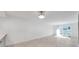 Bright living room with wood floors and sliding glass doors at 650 Island Way # 106, Clearwater Beach, FL 33767
