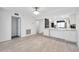 Spacious living area with wood-look flooring and an open layout perfect for entertaining at 650 Island Way # 106, Clearwater Beach, FL 33767
