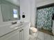 Simple bathroom with a shower, toilet, and vanity at 712 Gateway Ln, Tampa, FL 33613