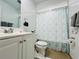 Clean bathroom with white vanity, toilet, and shower at 712 Gateway Ln, Tampa, FL 33613