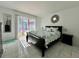 Bedroom with sliding glass doors to a pool area at 712 Gateway Ln, Tampa, FL 33613