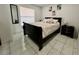 Bedroom with tile flooring and windows for natural light at 712 Gateway Ln, Tampa, FL 33613