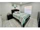 Bedroom featuring tile flooring, a bed, and nightstands at 712 Gateway Ln, Tampa, FL 33613