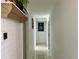 Bright hallway with tile flooring and artwork at 712 Gateway Ln, Tampa, FL 33613