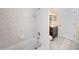 Clean bathroom with tiled floor and shower/tub combo at 9336 Tooke Shore Dr, Weeki Wachee, FL 34613