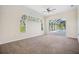 Bright bedroom with carpet flooring and pool view at 9336 Tooke Shore Dr, Weeki Wachee, FL 34613