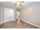 Spacious bedroom with wood-look flooring and adjacent bathroom at 9907 Ashburn Lake Dr, Tampa, FL 33610