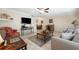 Bright living room with comfy seating, a coffee table, and a large TV at 10265 Gulf Blvd # A203, St Petersburg, FL 33706