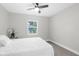 Bright bedroom with ceiling fan and large window at 10300 Gifford Dr, Spring Hill, FL 34608