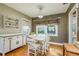 Quaint dining room featuring a vintage table and white cabinetry at 1453 Turner St, Clearwater, FL 33756