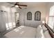 Bedroom featuring a large bed, soft lighting and a light-filled window with a view to the outside at 1506 Bentwood Dr, Sun City Center, FL 33573