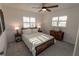 Spacious bedroom with a rustic-modern bed frame and ample sunlight at 1506 Bentwood Dr, Sun City Center, FL 33573