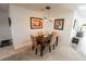 Dining area with a four-seat table, neutral decor and modern lighting at 1506 Bentwood Dr, Sun City Center, FL 33573