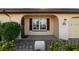 Front porch with decorative wreath and a view of the house entrance at 1506 Bentwood Dr, Sun City Center, FL 33573