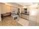 Bright kitchen with granite counters and white cabinetry at 1506 Bentwood Dr, Sun City Center, FL 33573