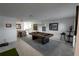 Spacious living room featuring a pool table and views of the kitchen and dining area at 1506 Bentwood Dr, Sun City Center, FL 33573