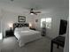 Bright main bedroom with a ceiling fan, comfortable mattress, carpet floors and ample natural light at 1506 Bentwood Dr, Sun City Center, FL 33573