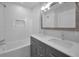 Bathroom featuring double vanity, tub, and shower at 1535 Manor S Way, St Petersburg, FL 33705