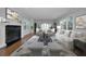 Living room featuring a marble fireplace, hardwood floors, and stylish furniture at 1535 Manor S Way, St Petersburg, FL 33705