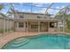 Large pool and patio with outdoor kitchen and screened enclosure at 16004 Shinnecock Dr, Odessa, FL 33556