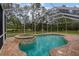 Inviting pool and spa with screened enclosure at 16004 Shinnecock Dr, Odessa, FL 33556