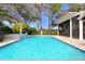 Relaxing pool area with a covered patio at 16407 Zurraquin De Avila, Tampa, FL 33613