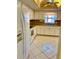 Efficient kitchen with ample cabinet space and a tile floor at 1660 S Lake Ave # 1, Clearwater, FL 33756