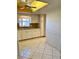 Bright kitchen with white cabinets and a tile floor at 1660 S Lake Ave # 1, Clearwater, FL 33756