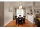 Dining room with hardwood floors and a large table with six chairs at 16828 Taylow Way, Odessa, FL 33556