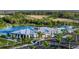 Resort-style community pool and clubhouse with pond at 17901 Solstice Ave, Venice, FL 34293