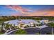 Community clubhouse with pool and outdoor seating at 17938 Solstice Ave, Venice, FL 34293