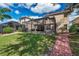 Spacious backyard with a pool and screened enclosure at 18014 Cozumel Isle Dr, Tampa, FL 33647