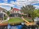 Backyard with canal access, pool, and spacious patio area at 18014 Cozumel Isle Dr, Tampa, FL 33647