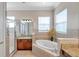Spa-like bathroom featuring a large soaking tub and walk-in shower at 18014 Cozumel Isle Dr, Tampa, FL 33647