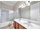 Bathroom boasts double vanity and shower/tub combo at 18014 Cozumel Isle Dr, Tampa, FL 33647