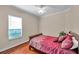 Cozy bedroom with a double bed and hardwood floors at 18014 Cozumel Isle Dr, Tampa, FL 33647
