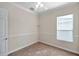 Spacious bedroom featuring a window with blinds and ceiling fan at 18014 Cozumel Isle Dr, Tampa, FL 33647