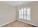 Spacious bedroom with neutral walls and a large window with shutters at 18014 Cozumel Isle Dr, Tampa, FL 33647
