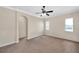 Spacious bedroom with ceiling fan, neutral walls, and ample natural light at 18014 Cozumel Isle Dr, Tampa, FL 33647