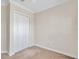 Simple bedroom with double door closet and neutral decor at 18014 Cozumel Isle Dr, Tampa, FL 33647