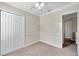 Charming bedroom with double closet and ceiling fan at 18014 Cozumel Isle Dr, Tampa, FL 33647