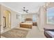 Spacious bedroom with a king-size bed, ceiling fan, and ample natural light at 18014 Cozumel Isle Dr, Tampa, FL 33647