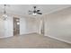Large bedroom with double doors and access to additional rooms at 18014 Cozumel Isle Dr, Tampa, FL 33647