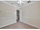 Well-lit bedroom with access to upstairs hallway at 18014 Cozumel Isle Dr, Tampa, FL 33647