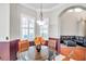 Bright breakfast nook with a glass-top table and seating for four at 18014 Cozumel Isle Dr, Tampa, FL 33647