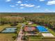 Aerial view of tennis courts, pickleball, and other community amenities at 18014 Cozumel Isle Dr, Tampa, FL 33647
