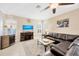 Gathering room with fireplace and large screen TV at 18014 Cozumel Isle Dr, Tampa, FL 33647