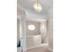Upper hallway with a circular window, neutral walls, and carpeting at 18014 Cozumel Isle Dr, Tampa, FL 33647