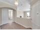 Bright hallway with neutral-toned walls and carpeting, offering access to other rooms at 18014 Cozumel Isle Dr, Tampa, FL 33647